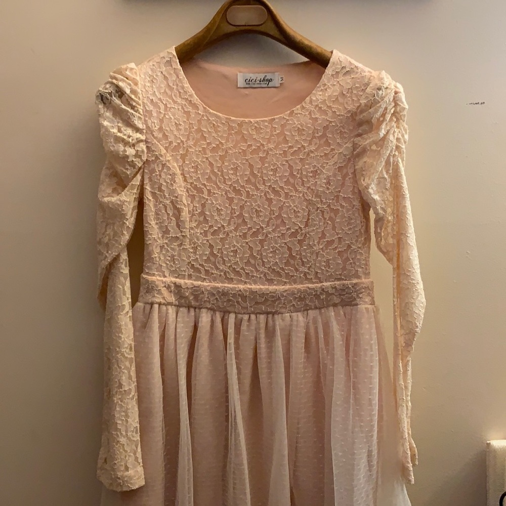 Laced long sleeve dress in blush pink.